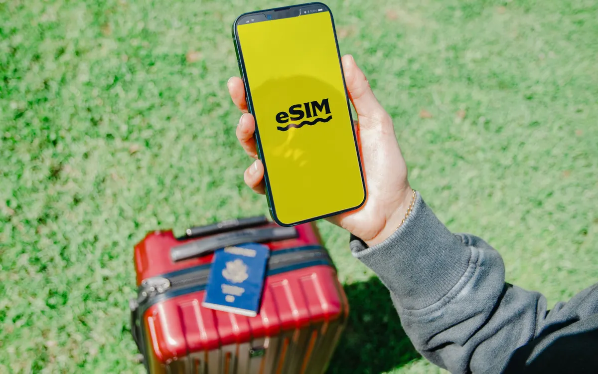 Istanbul first-time visitor tips: traveller checking a phone beside a suitcase