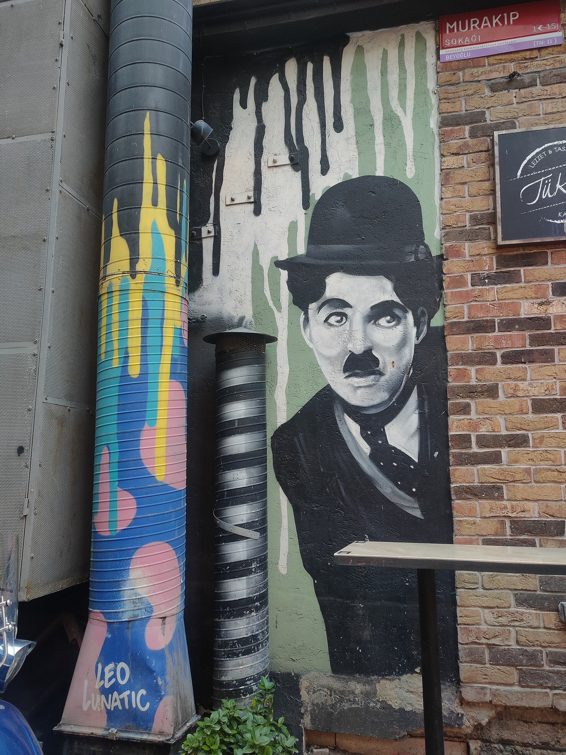 Street art mural beside a doorway in Karaköy, Istanbul