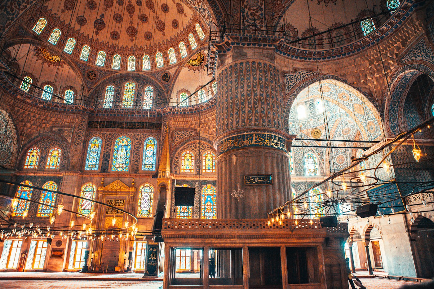 Decorated arches, windows and tiled walls inside Istanbul’s Blue Mosque