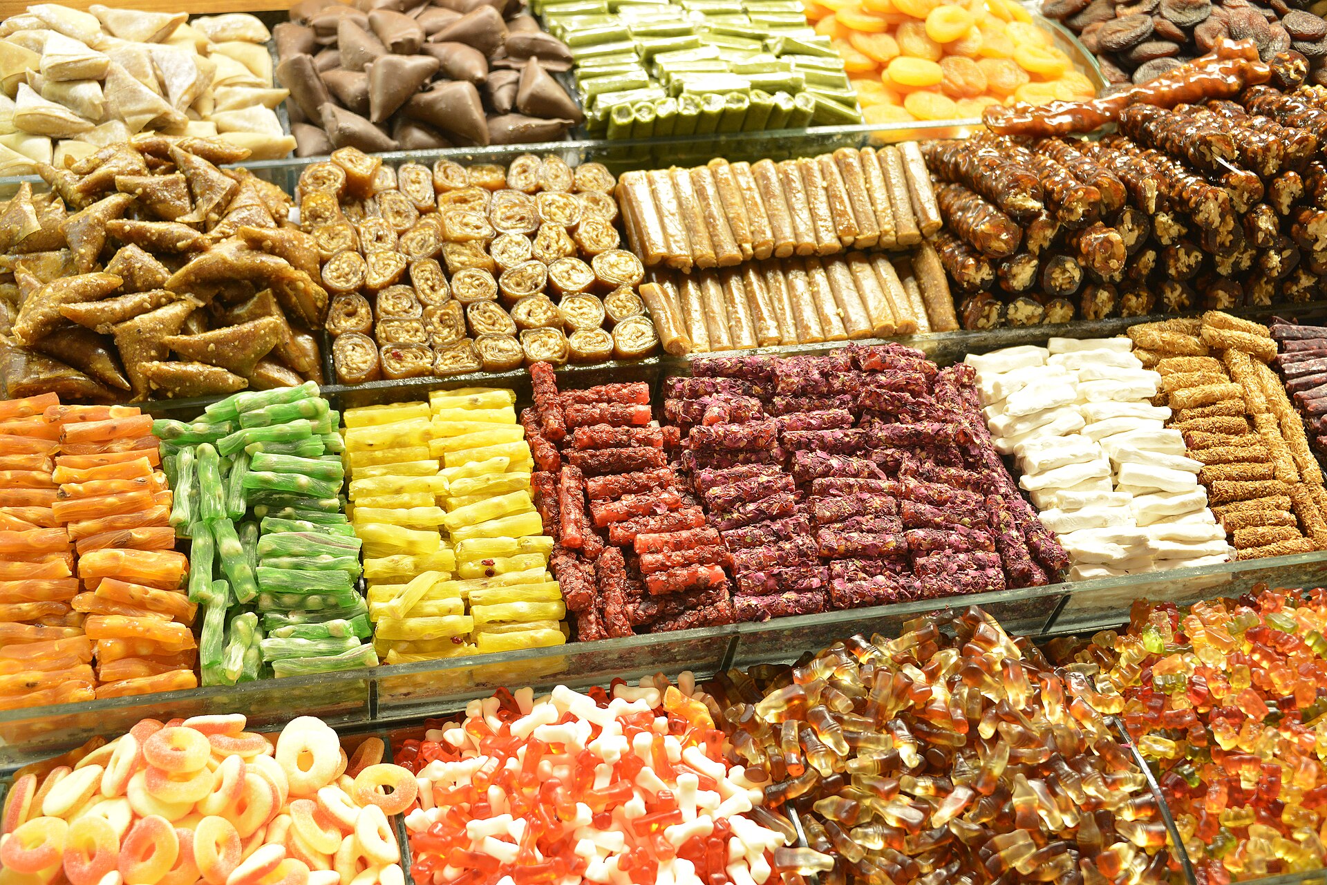 A market stall in Istanbul’s Spice Bazaar with trays of colourful Turkish sweets and nut pastries