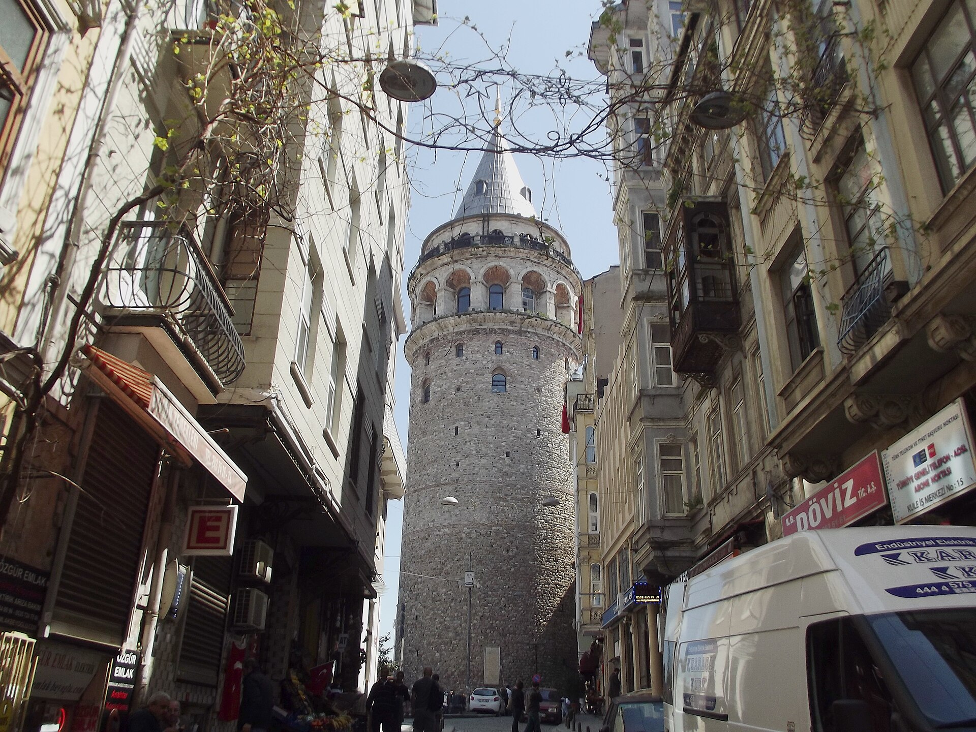 Galata Tower rising above narrow streets and old buildings in Beyoğlu