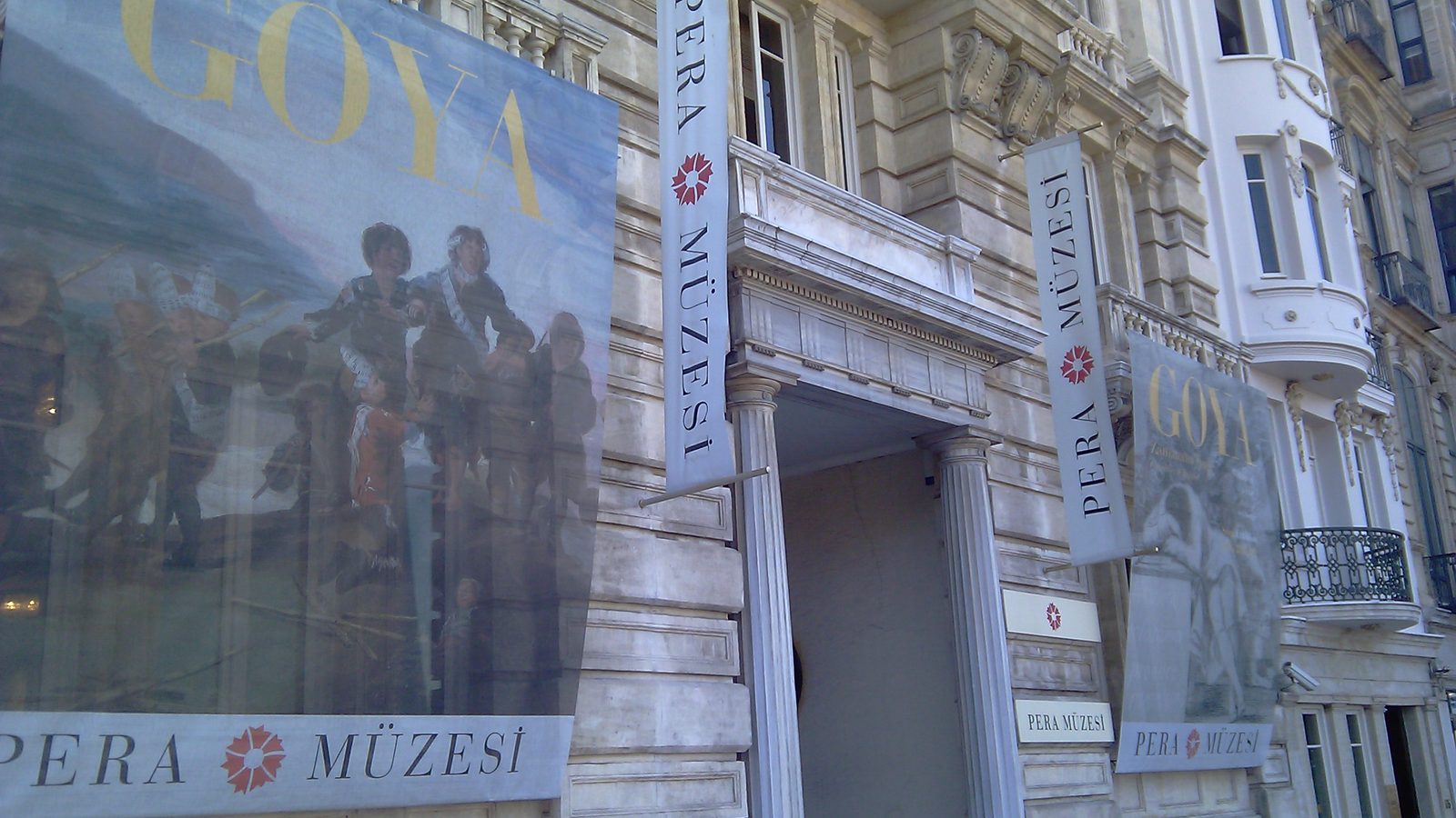Facade of the Pera Museum on Meşrutiyet Caddesi in Beyoğlu with exhibition banners
