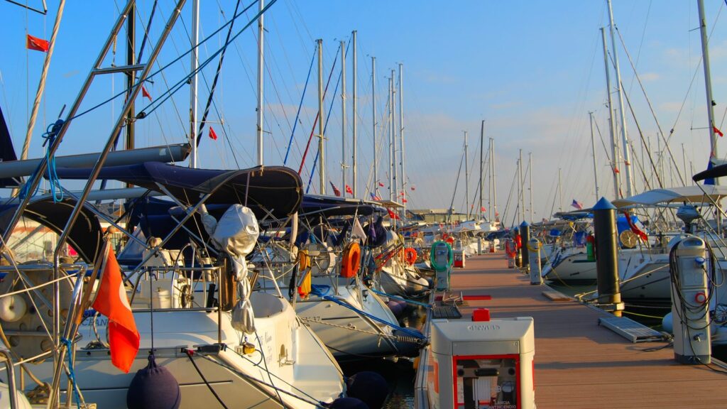 Yachts moored along a wooden pontoon at Viaport Marina in Tuzla on a sunny day
