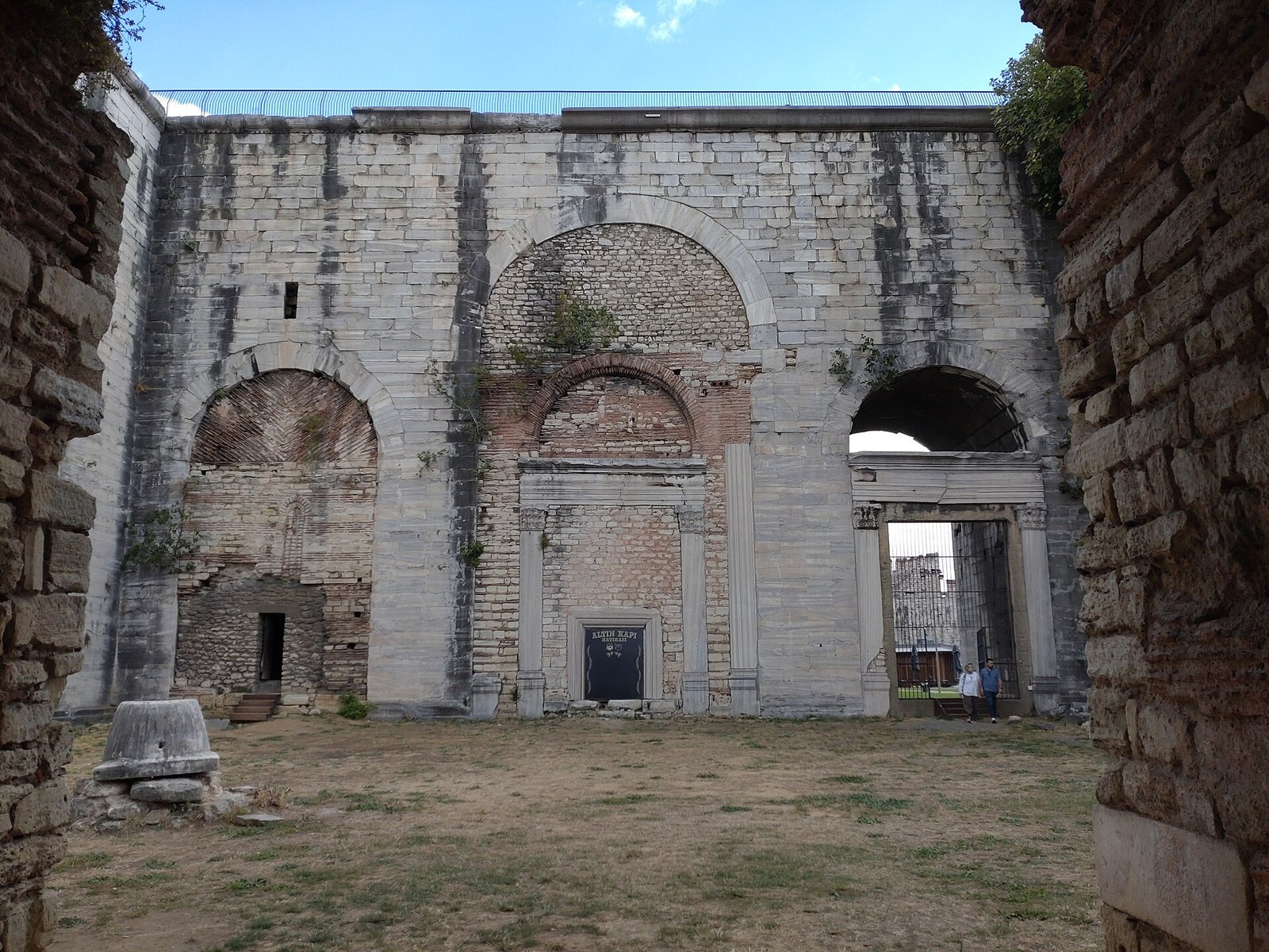 Weathered stone walls and arched openings inside Yedikule Fortress